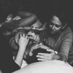 Ashley cares for a mom during labor. 